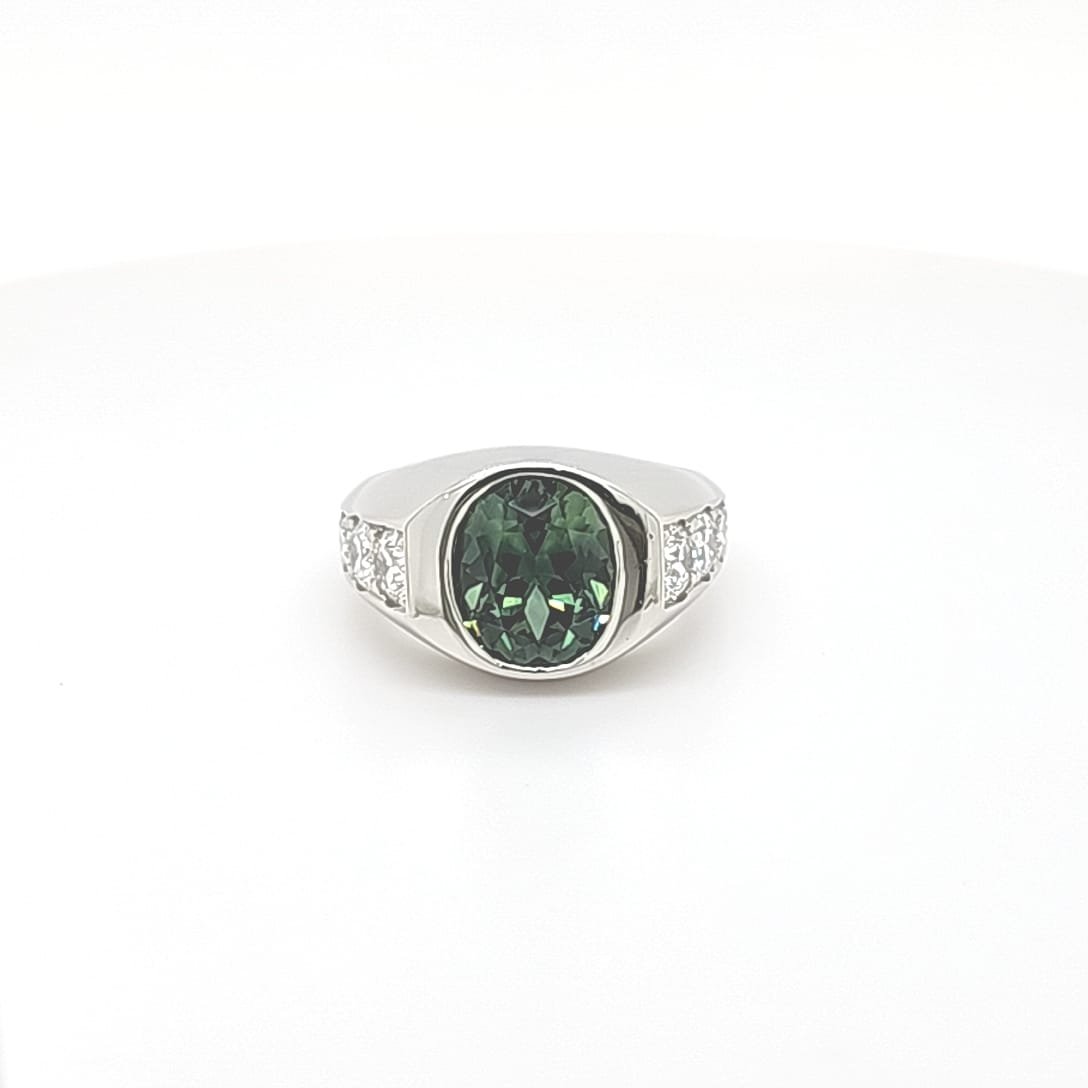Framing this central treasure, ten round brilliant-cut diamonds-five on each side-offer a dazzling counterbalance.